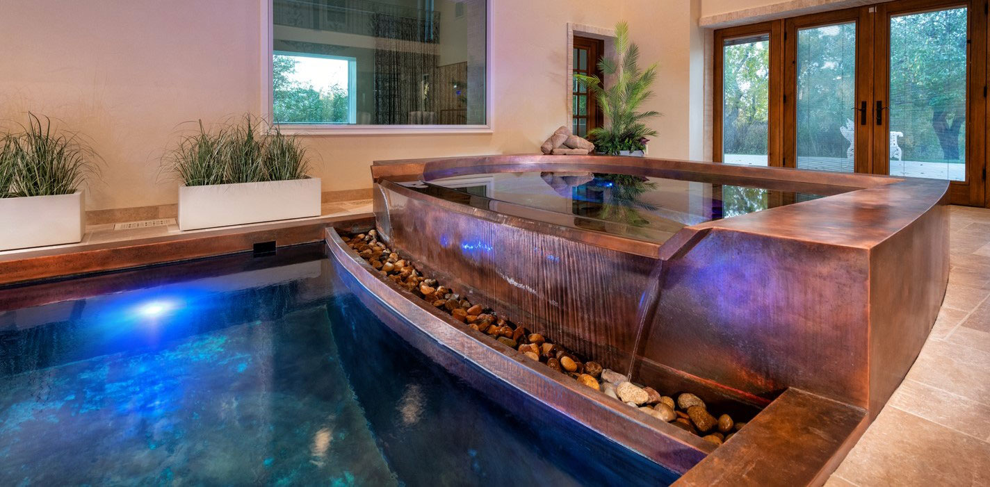 Copper pool and spa.  The pool has an interior descending stairway and two underwater hydraulic treadmills with swim jet systems and LED lighting.  The spa has LED lighting, front spill over water feature, two loungers and bench seating.  133