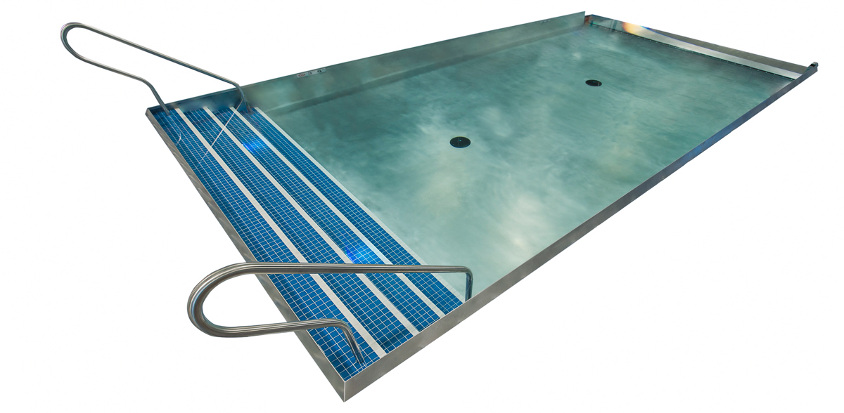 Stainless steel rooftop commercial pool with LED lighting, tiled interior stairway, three-sided infinity edge descending into catch basin and acrylic wall at end of pool. 223”x376”x53”.  Glass panel 223”x 101” tall.